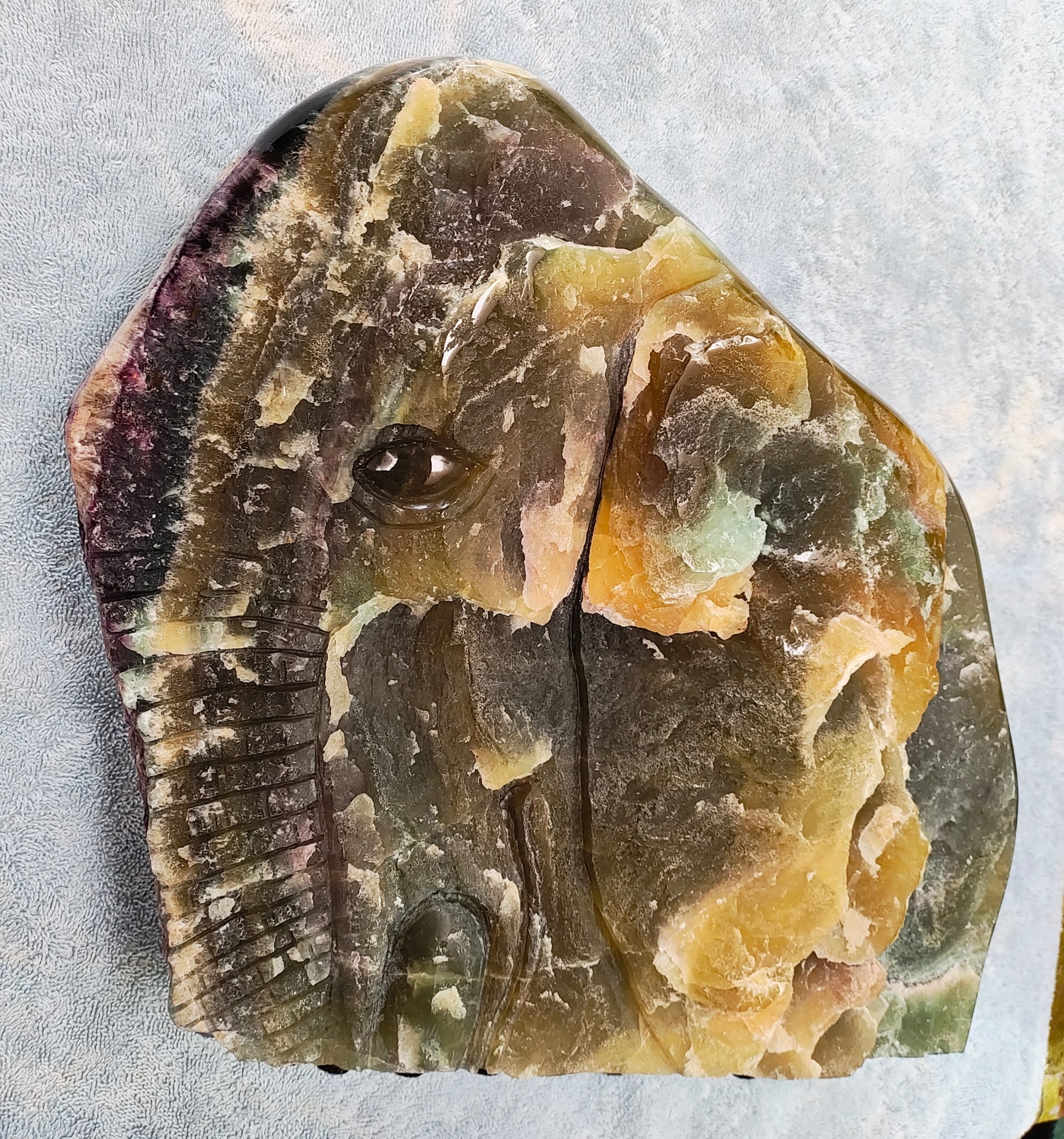 Painting of a house with a tree and bushes in a night scene with moon and stars